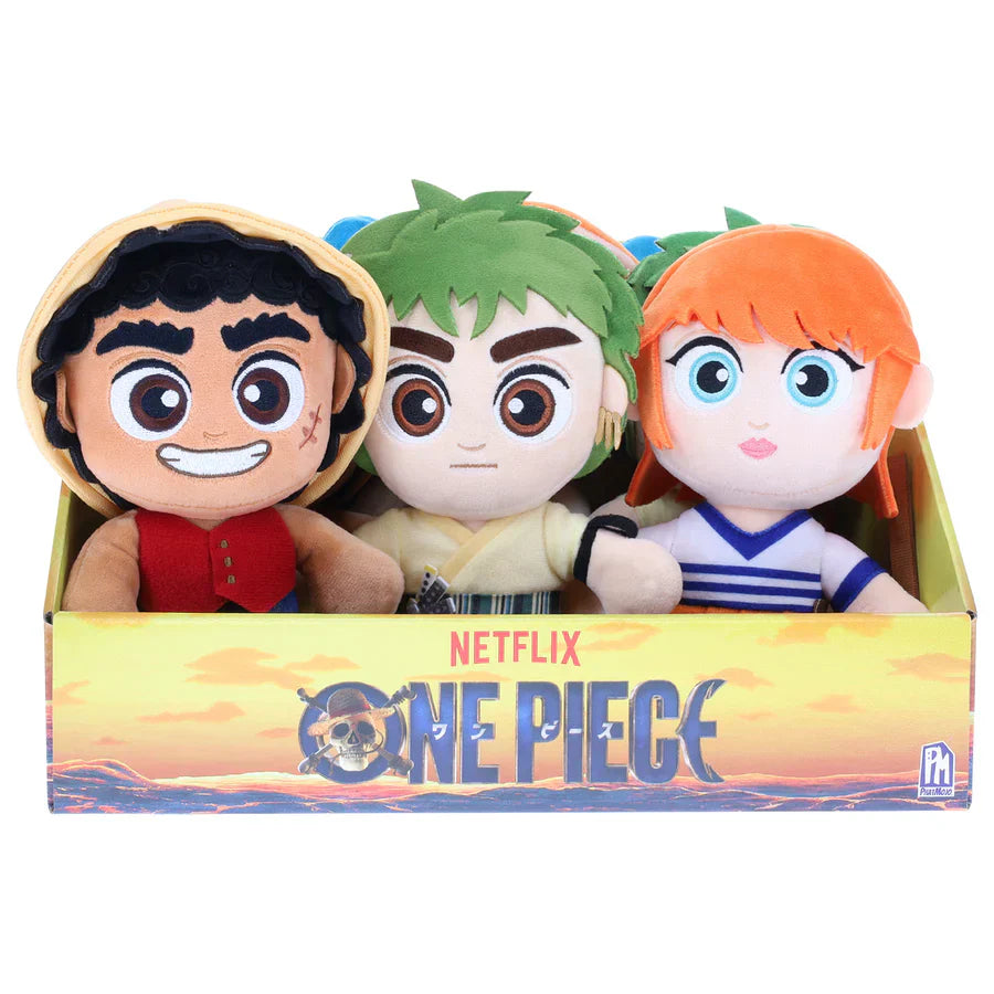 Three plush toys in a box with 'Netflix One Piece' branding on a white background