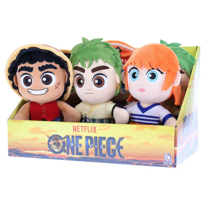 Three plush toys in a box with 'One Piece' branding on a white background