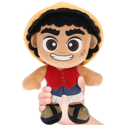 Plush toy of a character with a straw hat, red shirt, and blue shorts on a white background