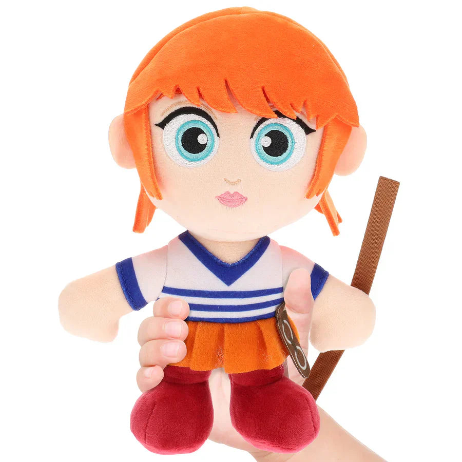 Plush toy of a character with orange hair and a blue and white outfit on a white background