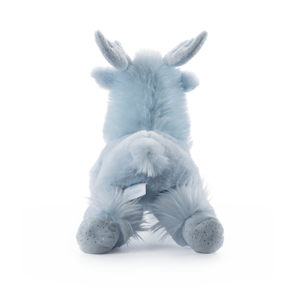 Plush unicorn toy in light blue on a white background