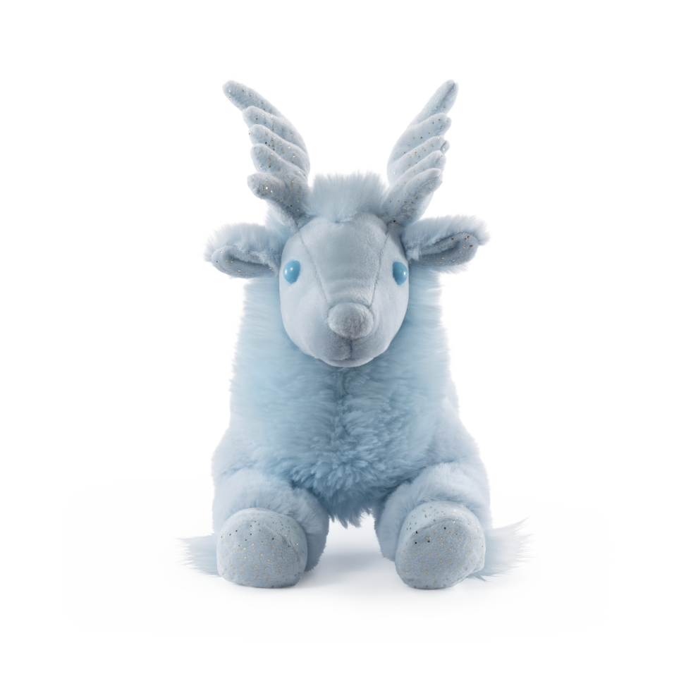 Blue plush toy goat with white horns on a white background