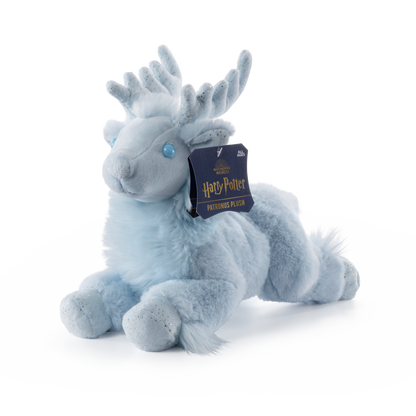 Plush toy resembling a creature with antlers and a Harry Potter tag on a white background