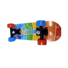 Colourful skateboard with rainbow design and 'Rainbow' text on a white background