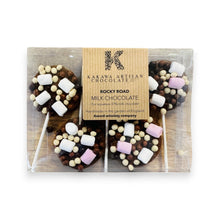 Packaged rocky road milk chocolate lollipops with a Kakawa Artisan Chocolate box.