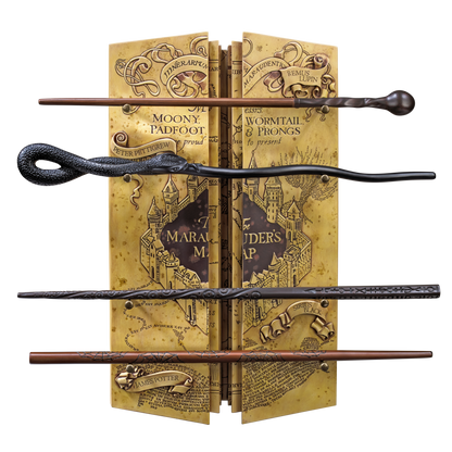 Four wizarding wands on a book with magical map design