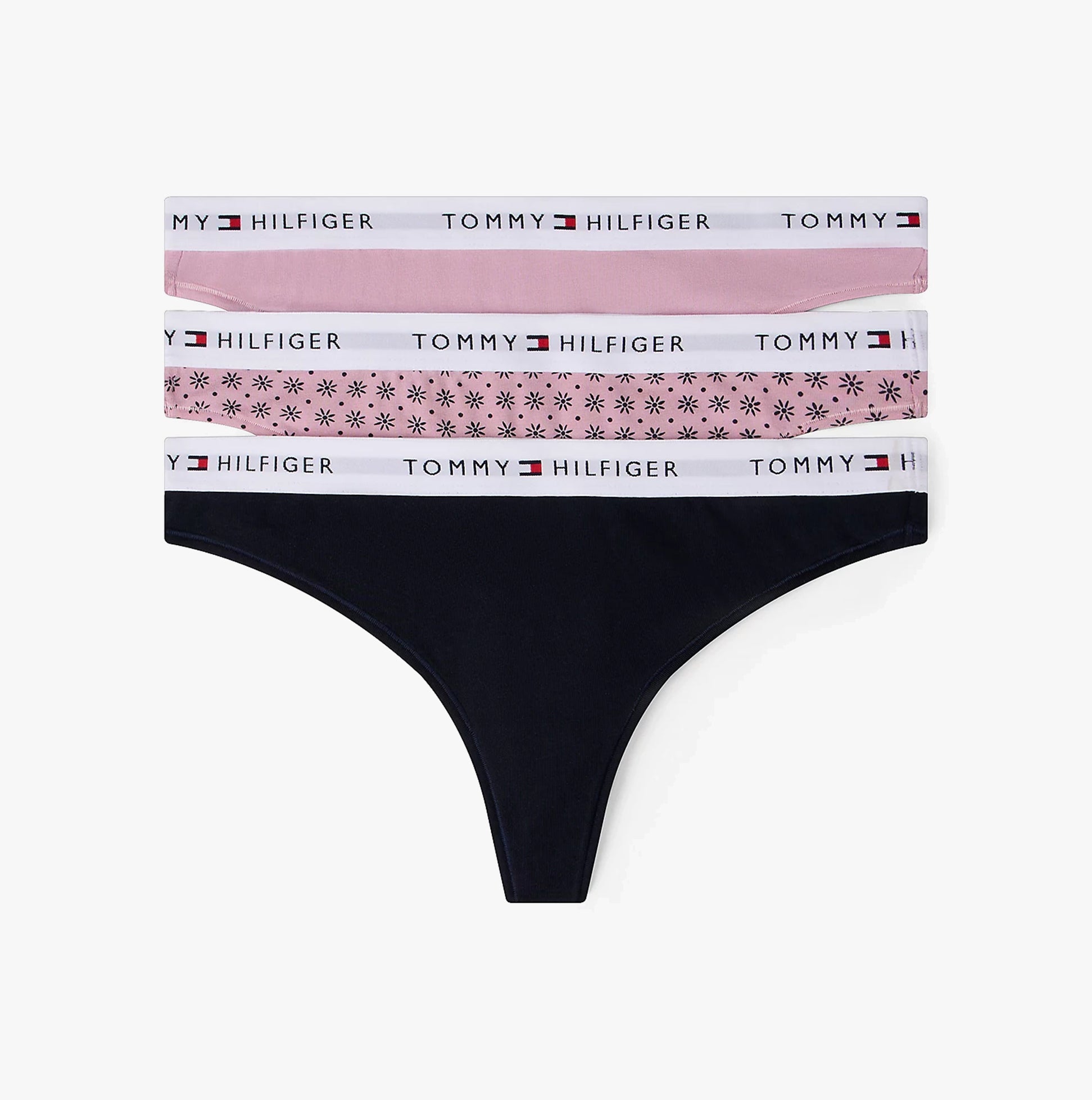 Black thong with floral and solid color waistbands on a white background, featuring Tommy Hilfiger branding.