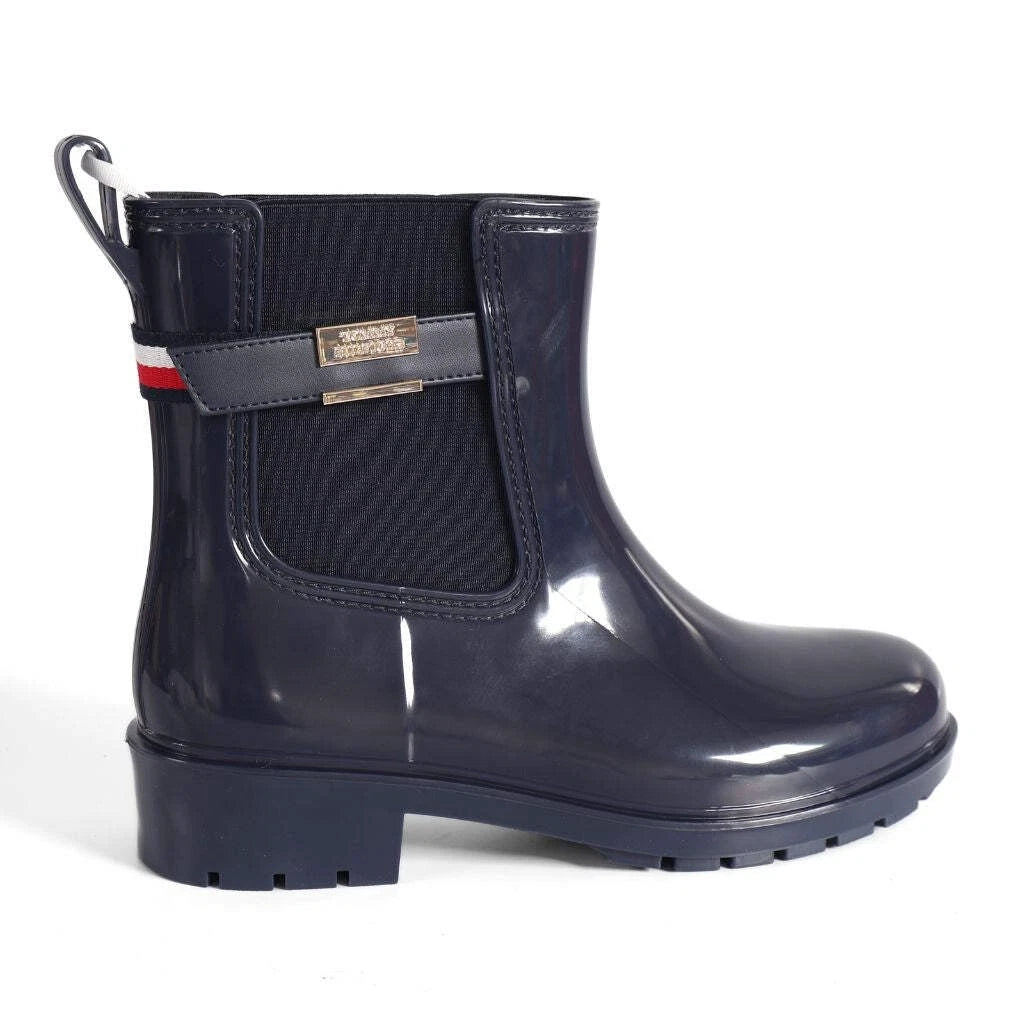 Tommy Hilfiger Women’s Flag Belt Rainboots in Space Blue. Waterproof, stylish & durable for any weather. Shop now at New, Used and More!