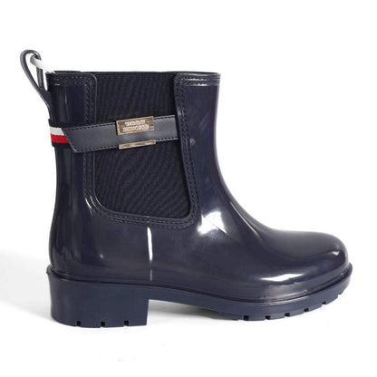Tommy Hilfiger Women’s Flag Belt Rainboots in Space Blue. Waterproof, stylish & durable for any weather. Shop now at New, Used and More!
