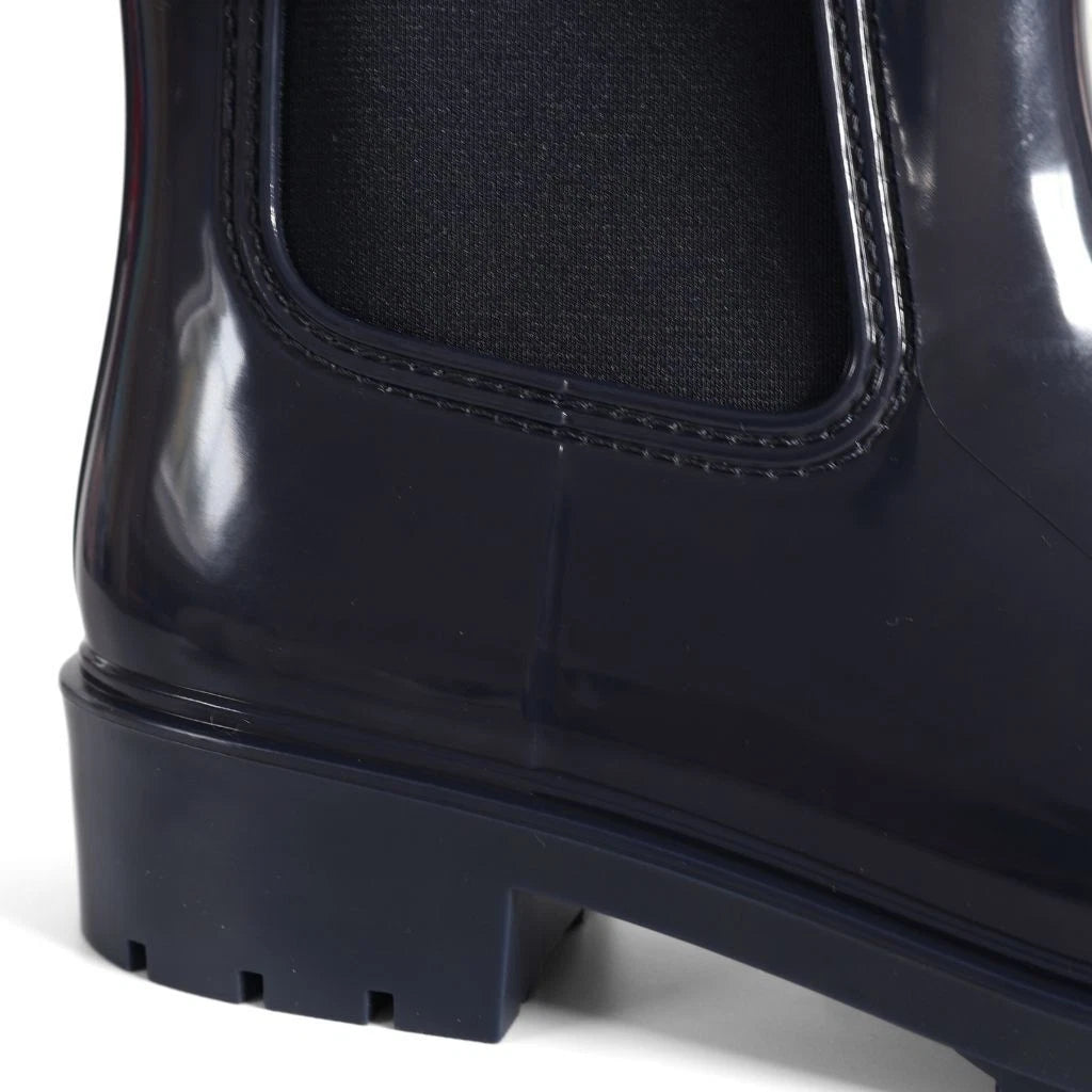 Tommy Hilfiger Women’s Flag Belt Rainboots in Space Blue. Waterproof, stylish & durable for any weather. Shop now at New, Used and More!