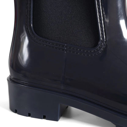 Tommy Hilfiger Women’s Flag Belt Rainboots in Space Blue. Waterproof, stylish & durable for any weather. Shop now at New, Used and More!