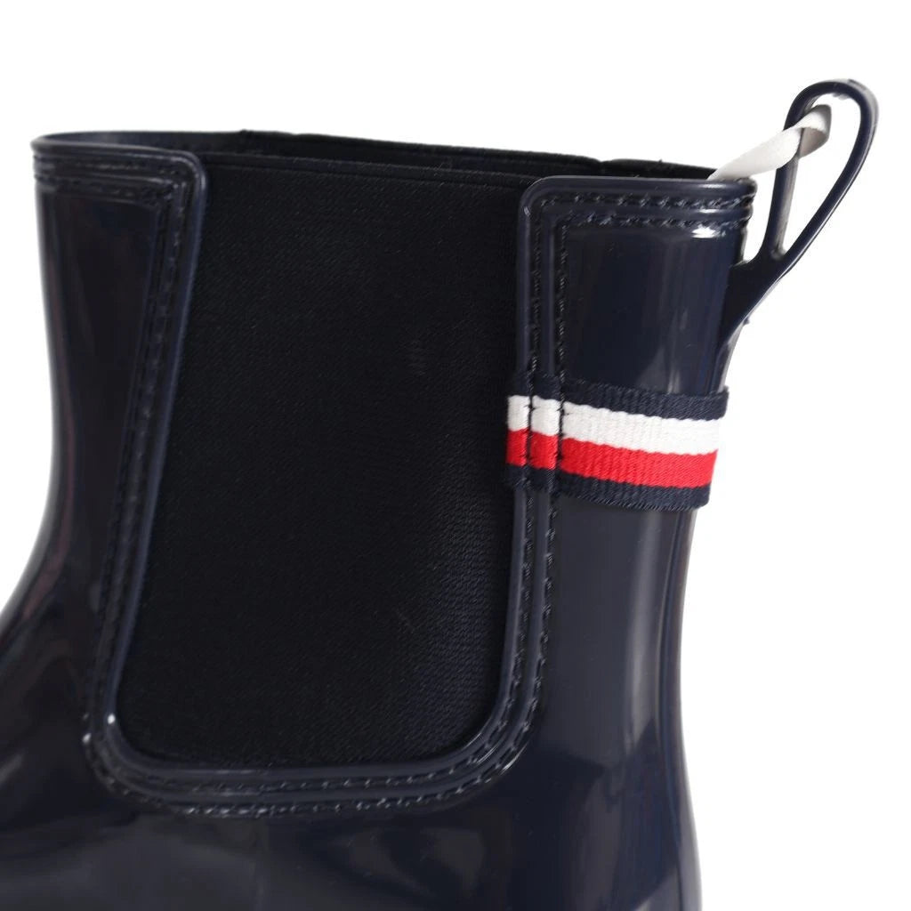 Tommy Hilfiger Women’s Flag Belt Rainboots in Space Blue. Waterproof, stylish & durable for any weather. Shop now at New, Used and More!