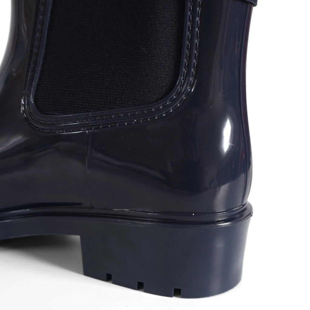 Tommy Hilfiger Women’s Flag Belt Rainboots in Space Blue. Waterproof, stylish & durable for any weather. Shop now at New, Used and More!