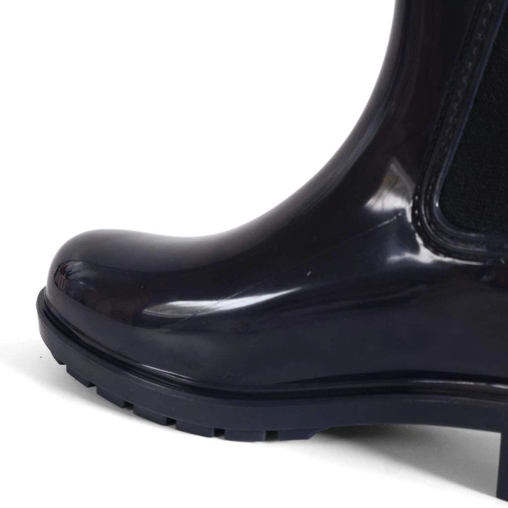 Tommy Hilfiger Women’s Flag Belt Rainboots in Space Blue. Waterproof, stylish & durable for any weather. Shop now at New, Used and More!