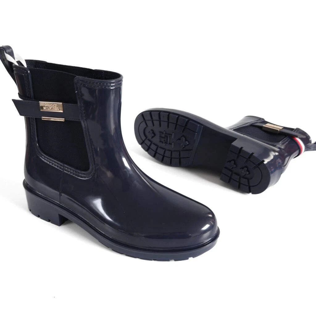 Tommy Hilfiger Women’s Flag Belt Rainboots in Space Blue. Waterproof, stylish & durable for any weather. Shop now at New, Used and More!