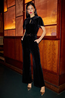 Black Velvet Jumpsuit With Twist Neckline And Buckle Belt