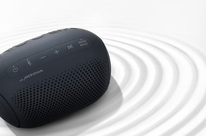 Black portable speaker with visible branding on a white background