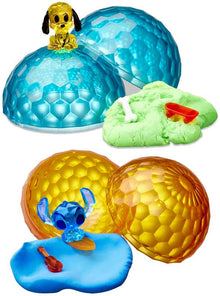 Toy set with blue, orange, and green translucent balls featuring cartoon characters on a white background.