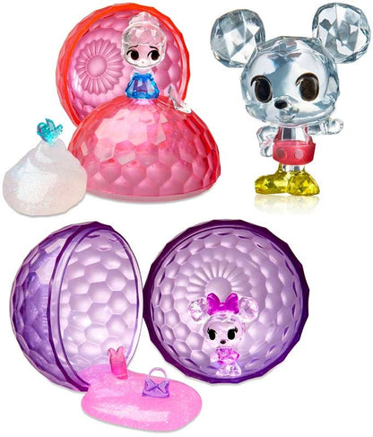 Set of colorful toys with transparent figures inside spherical containers on a white background