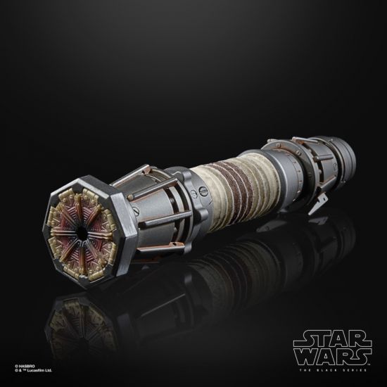 Star Wars lightsaber hilt on a reflective surface with a black background