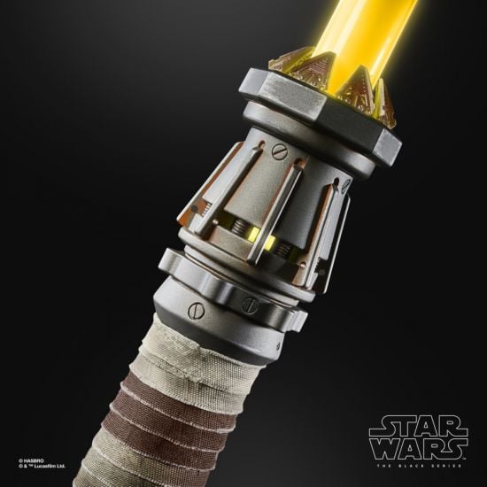 Close-up of a lightsaber handle with a dark background, featuring the Star Wars logo.