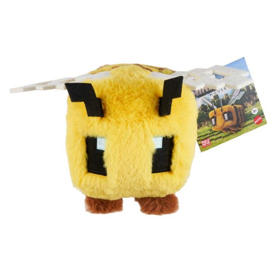 Yellow plush toy with black accents from mincraft on a white background