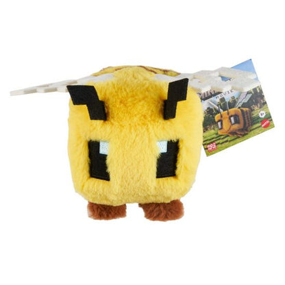 Yellow plush toy with black accents from mincraft on a white background