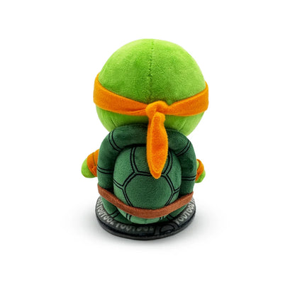 TMNT Green plush toy with orange bandana on a white background