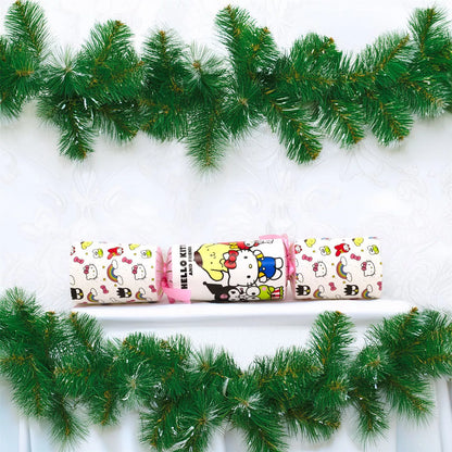 Decorative Christmas cracker with Hello Kitty design on a white background with green garland.