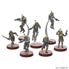 Set of Star Wars miniatures figures on red bases with a white background