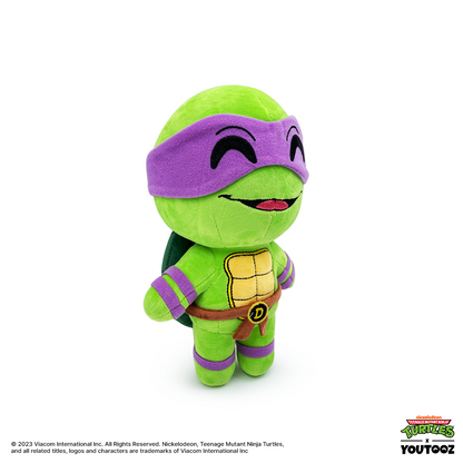 TMNT Green plush toy with purple mask on a white background