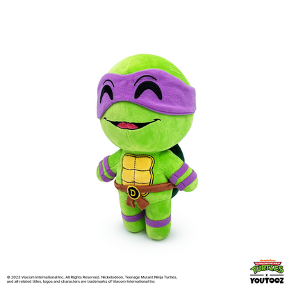 TMNT Green plush toy with purple mask on a white background
