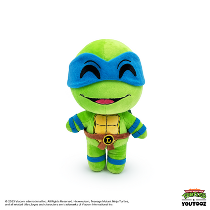 Plush toy of a green turtle character with blue mask on a white background
