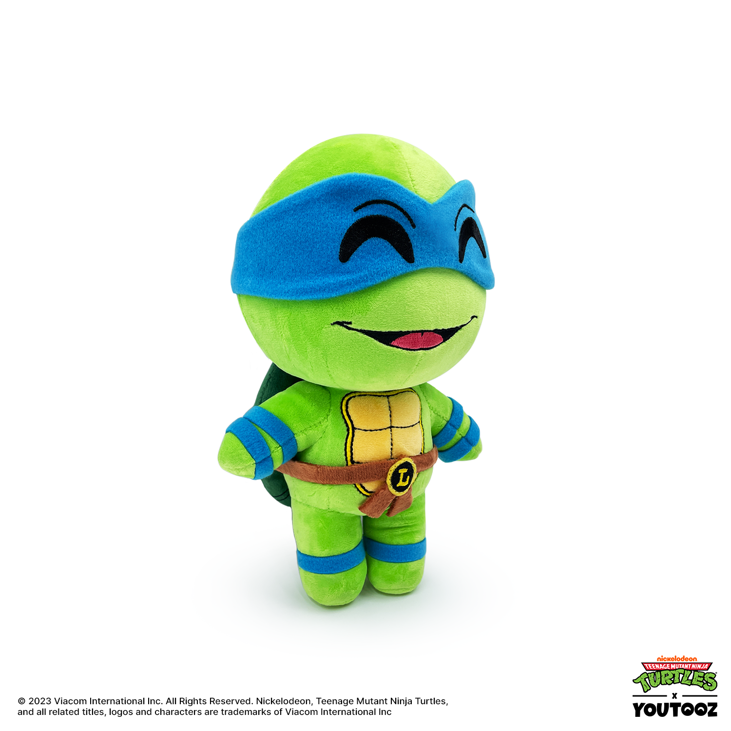 Plush toy of a green turtle character with blue mask on a white background