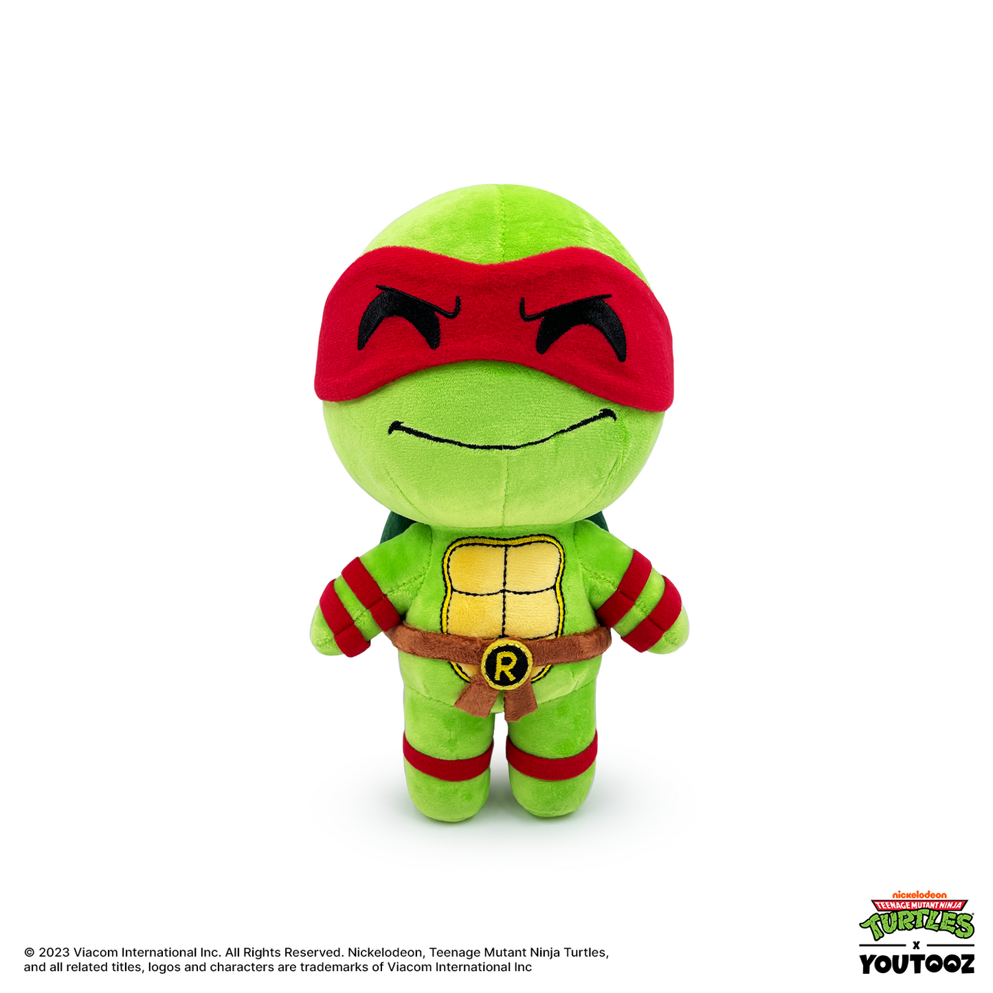 Plush toy of a green turtle character with a red mask on a white background