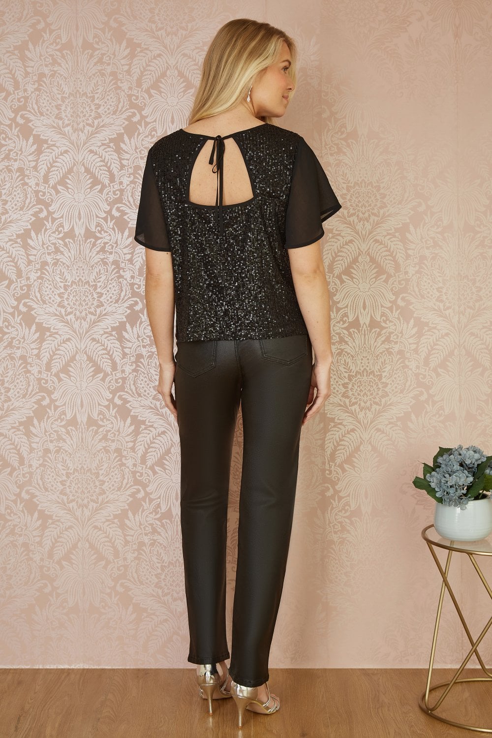 Black Sequin Top With Sheer Sleeves And Cut Out Back